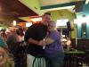 Randy Lee Ashcraft gives a hug to Bonnie (from Pa.) at Smitty McGee’s. photo by Larry Testerman